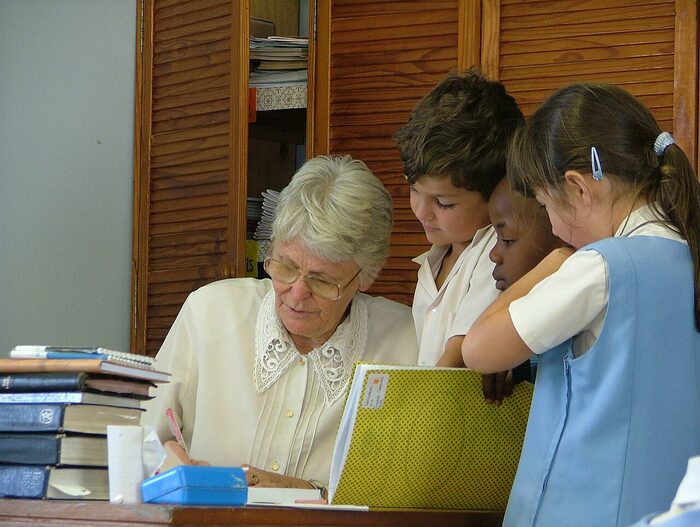 A teacher working through a lesson with a small group of pupils